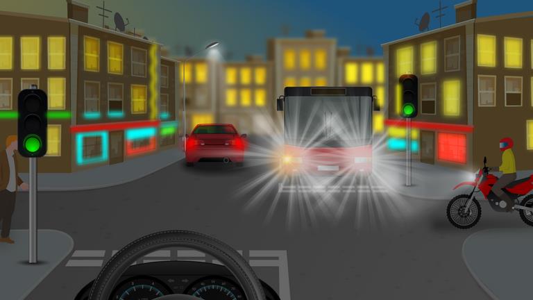 What should a driver be aware of when driving at night along a shopping street with many different light sources?