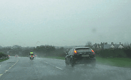 How does rain affect driving in this situation?